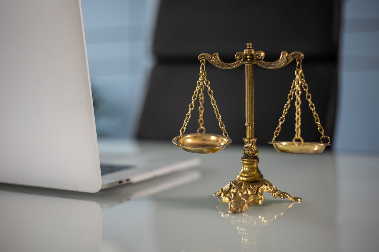 Scales of justice on an office desk