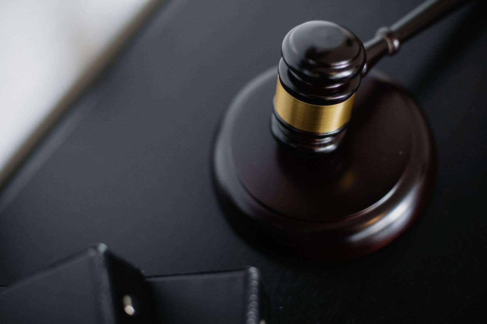 Judge's gavel resting on its sound block